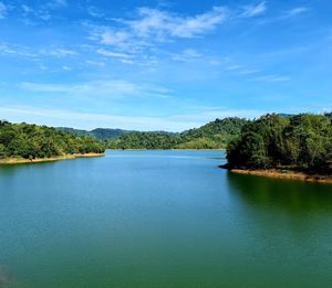 Scenic view of lake against blue sky