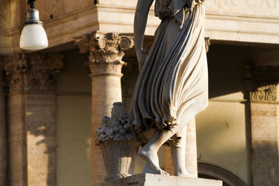 Detail of the statue of the goddess flora, piazza del popolo rome, sunset time.