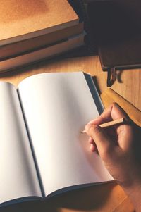 Close-up of woman holding pencil