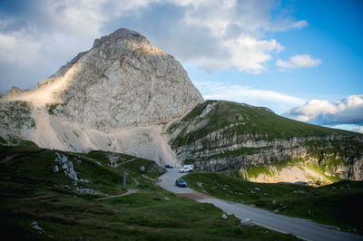 Scenic view of mountain against cloudy sky