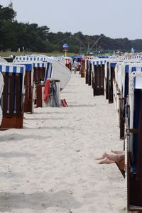 Clothes drying on beach against sky