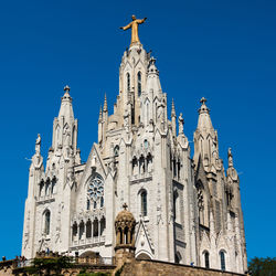 Low angle view of statue against blue sky