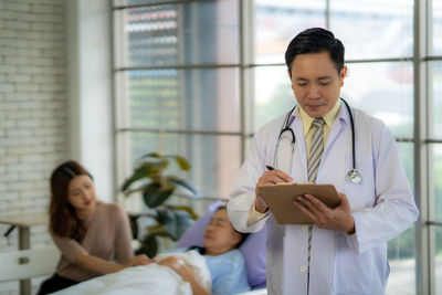 Portrait of doctor standing in hospital