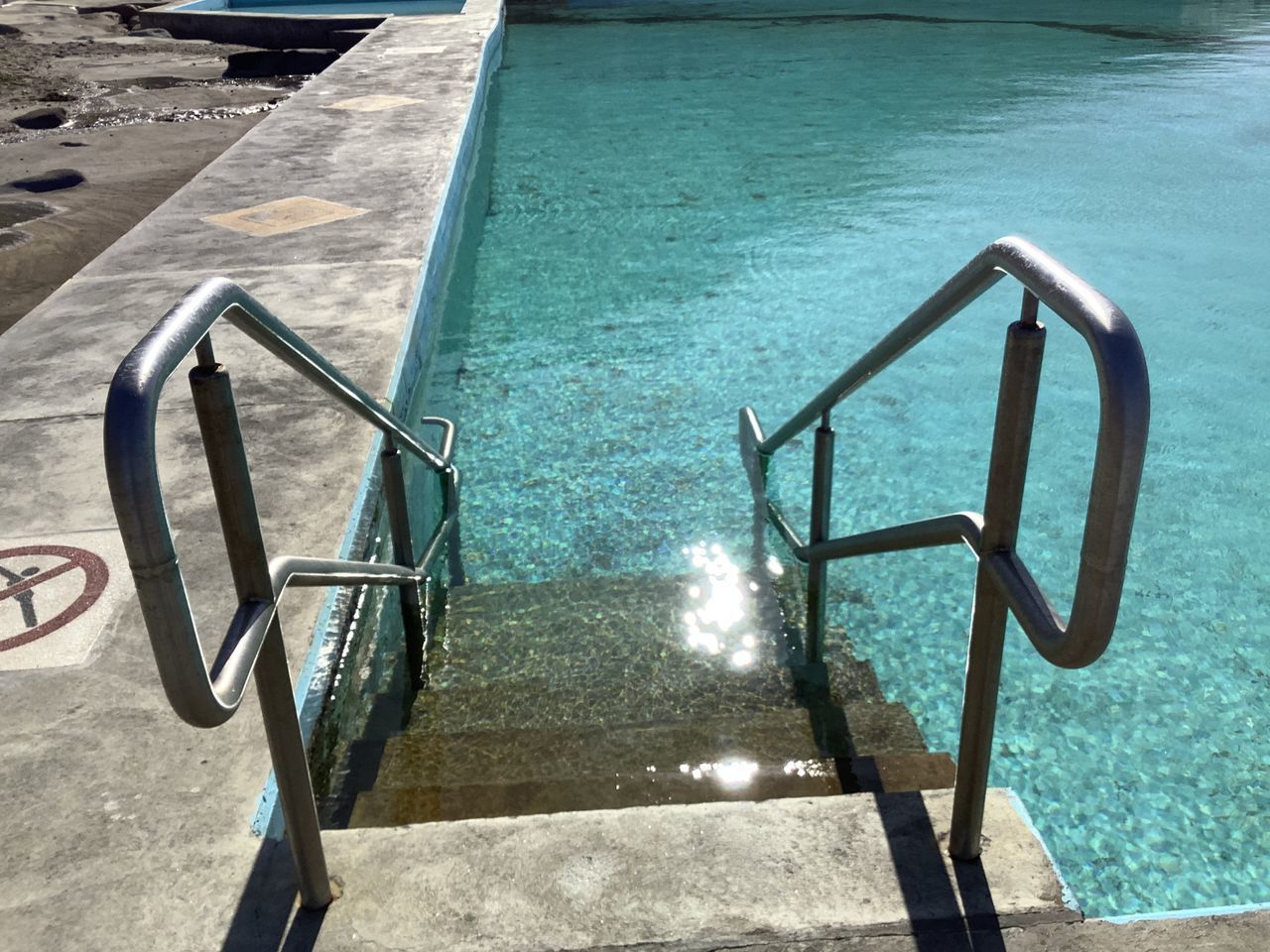 HIGH ANGLE VIEW OF SWIMMING POOL AT RIVERBANK