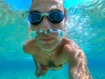 Portrait of young man in swimming pool