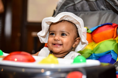 Portrait of cute baby girl at home