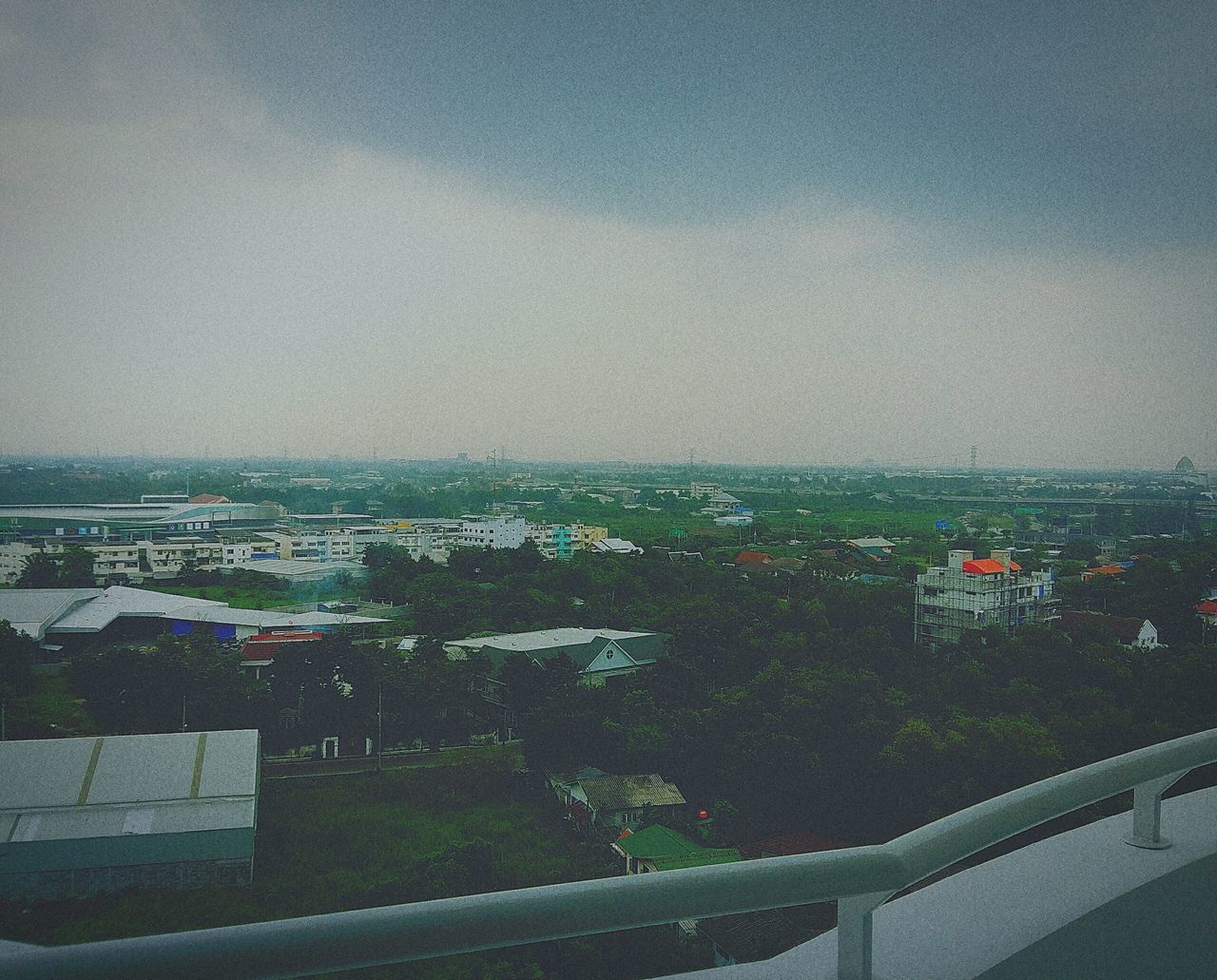 building exterior, sky, built structure, architecture, high angle view, city, horizon over water, sea, cityscape, outdoors, day, road, street, nature, house, residential district, residential structure, no people, water, residential building