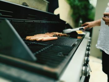 Midsection of man preparing food at home