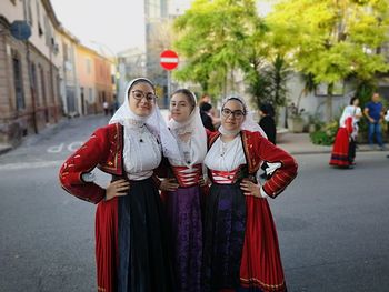 Portrait of women standing on street