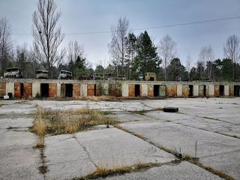 View of cemetery by building against sky