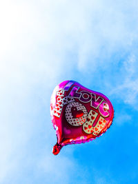 Low angle view of balloon against blue sky