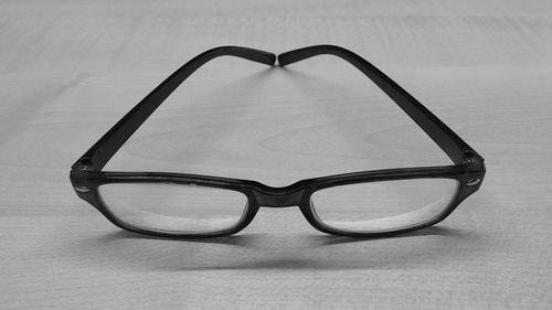 Close-up of eyeglasses on table