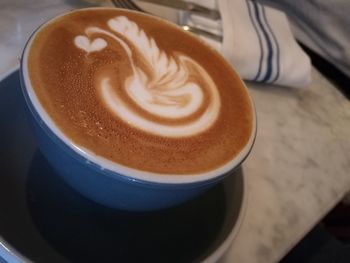 Close-up of cappuccino on table