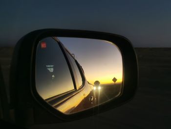 Reflection of car on side-view mirror