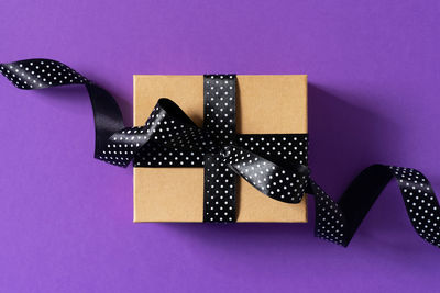 Close-up of paper against purple background