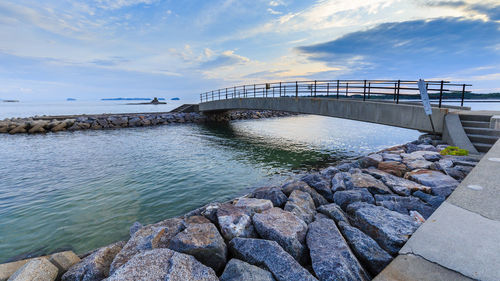 Bridge over sea against sky