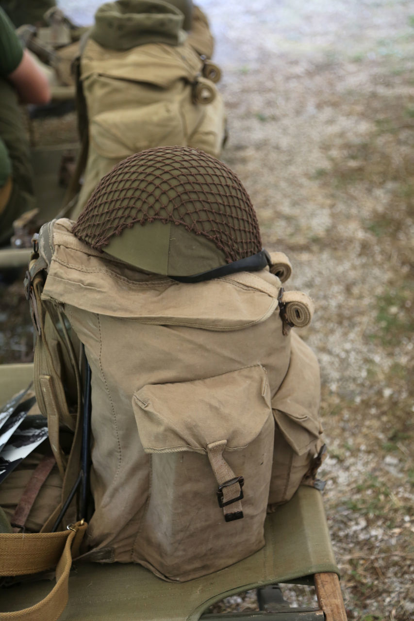 REAR VIEW OF MAN IN HAT