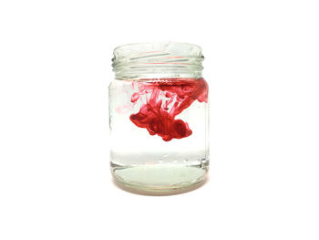 Close-up of jar against white background