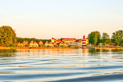 Scenic view of lake against orange sky