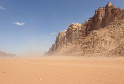 Rock formations in desert against sky