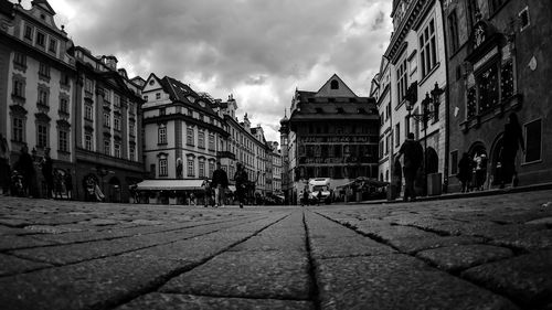 Street amidst buildings in city against sky