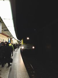 Street lights in illuminated city at night