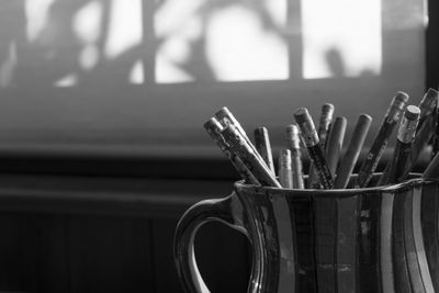 Close-up of paintbrushes on table at home