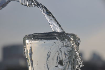 Close-up of ice crystals against water