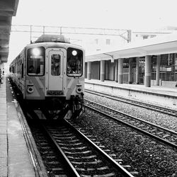 Train at railroad station against sky