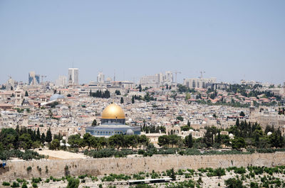 View of cityscape against clear sky