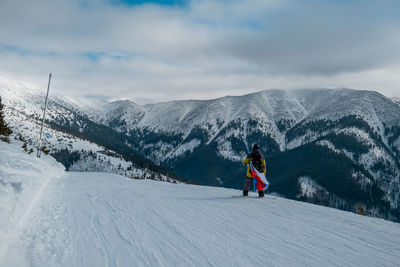 Man skiing on snow covered mountain