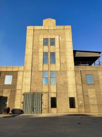 Low angle view of building against blue sky