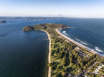 Drone view of palm beach and barrenjoey head and lighthouse, northern beaches, sydney, australia.