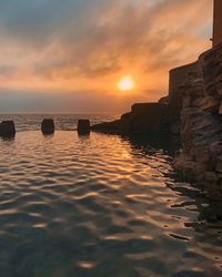 Scenic view of sea against sky during sunset