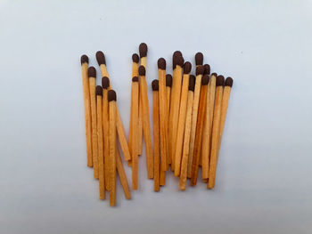 Directly above shot of matchsticks white background