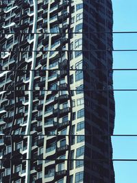 Low angle view of office building against sky