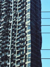 Low angle view of office building against sky