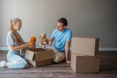 Portrait of boy playing with teddy bear