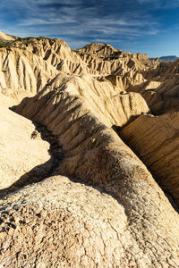 Rock formation on land against sky