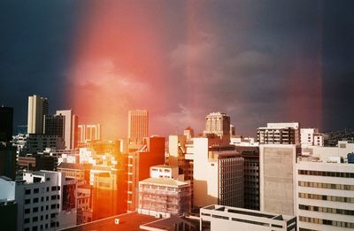 Modern buildings in city against sky