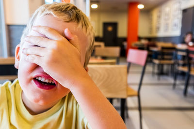 Close-up portrait of boy on table