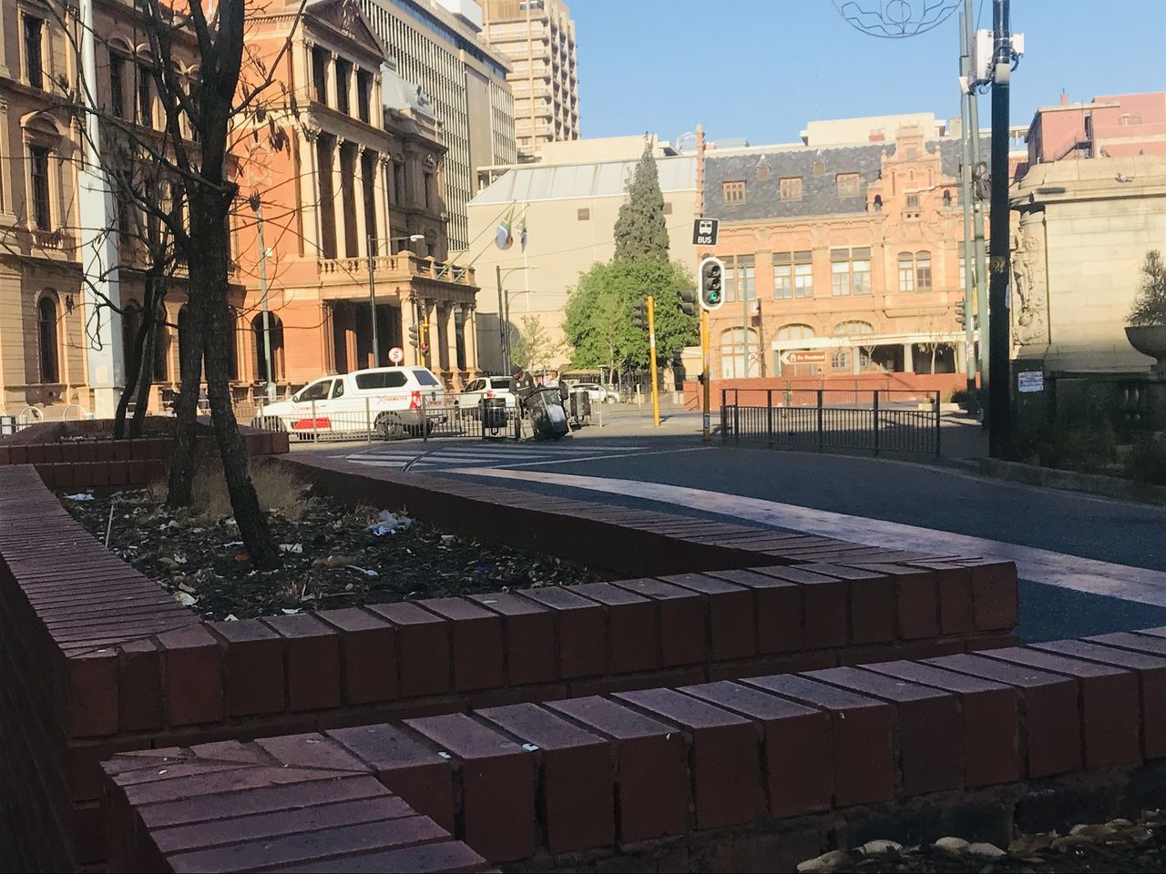 STREET BY BUILDINGS IN CITY DURING RAINY SEASON