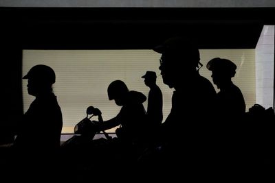 Silhouette people at music concert