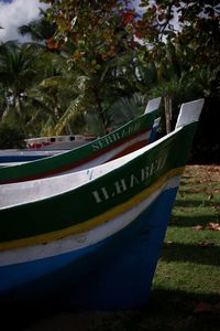 Close-up of boat moored on shore