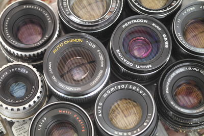 High angle view of camera lens arranged for sale at market