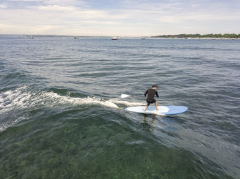 Aerial view of stand up paddle surfing