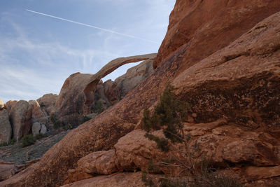 Rock formations on landscape against sky