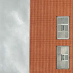 Low angle view of building against cloudy sky