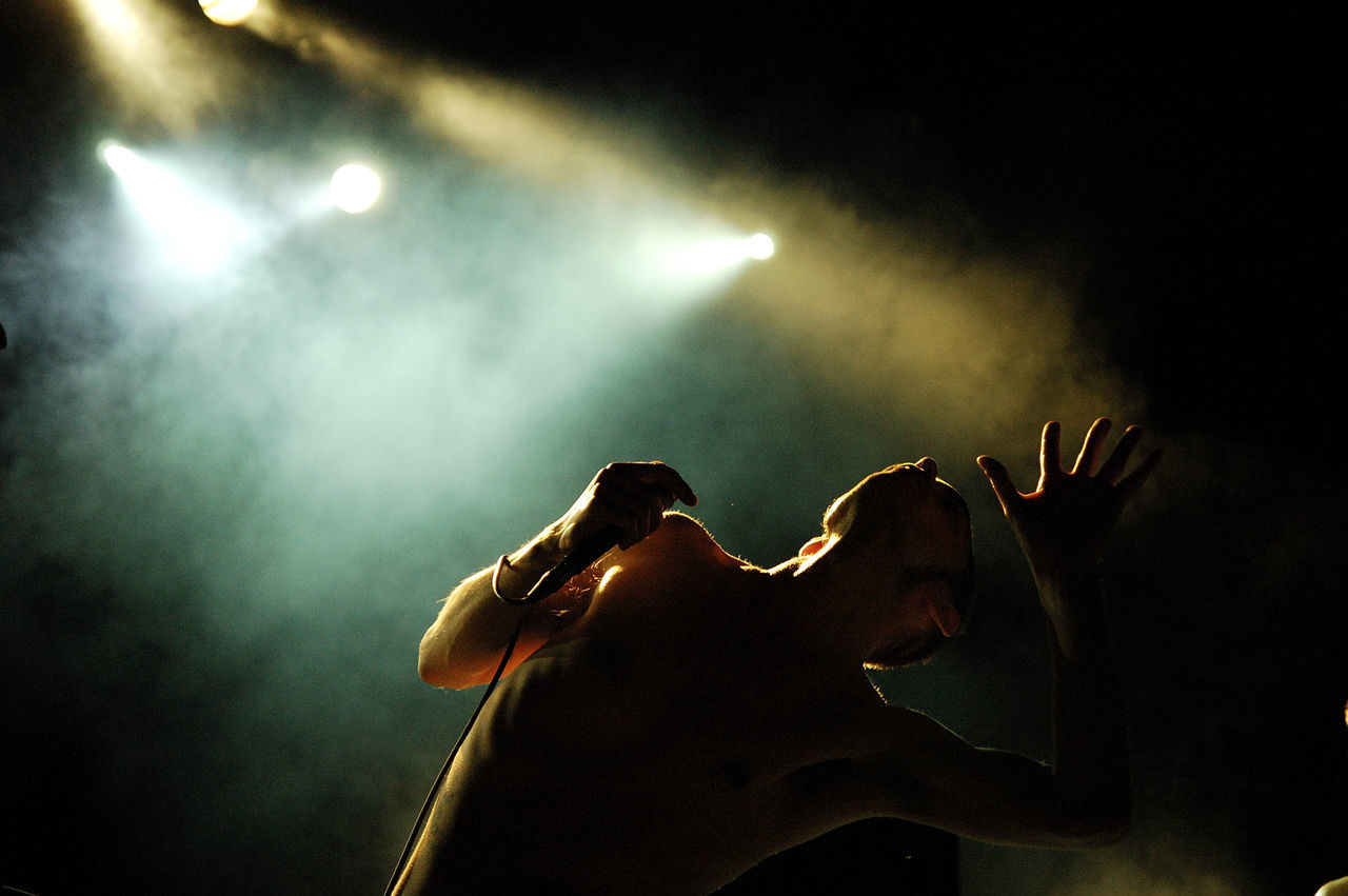 CLOSE-UP OF HAND WITH ILLUMINATED LIGHTING EQUIPMENT