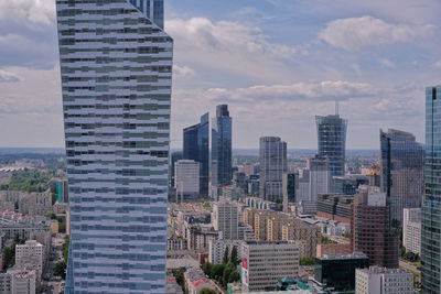 Modern buildings in city against sky